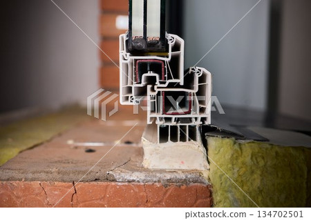 Closeup of window assembly components, Macro view of window frame with insulation and gasket, Technical study of window profile and energy efficient sealing methods 134702501