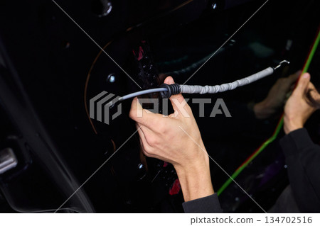 Painter applying new paint, Automotive painter meticulously applying vibrant new coating, Professional person precisely applying glossy fresh paint to vehicle surface Painter applying new paint, Automotive painter meticulously applying vibrant new coating, Professional person precisely applying glossy fresh paint to vehicle surface 134702516