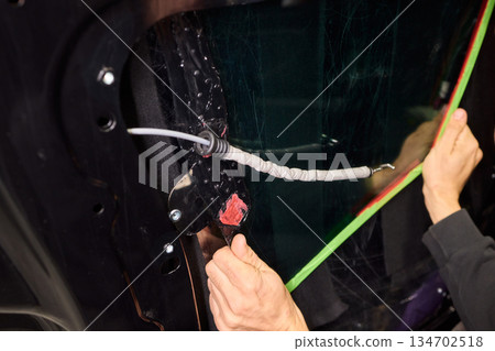 Painter applying new paint, Automotive painter meticulously applying vibrant new coating, Professional person precisely applying glossy fresh paint to vehicle surface Painter applying new paint, Automotive painter meticulously applying vibrant new coating, Professional person precisely applying glossy fresh paint to vehicle surface 134702518