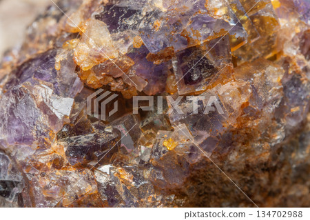 Mineral formation with fluorite crystals found in rock in middle of natural environment 134702988