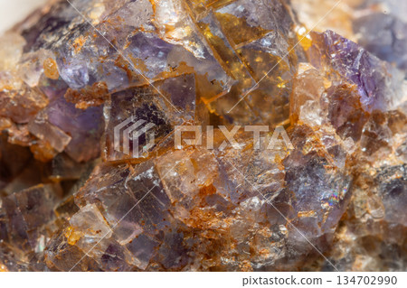 Mineral formation with fluorite crystals found in rock in middle of natural environment 134702990