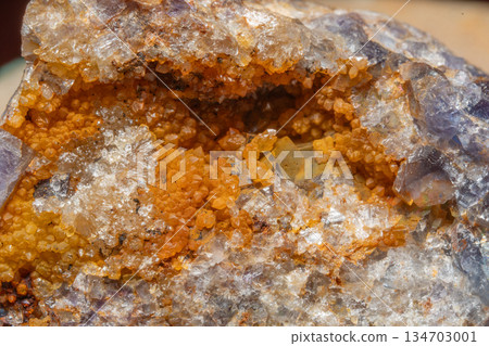 Close-up of mineral with crystals and particles in natural location Close-up of mineral with crystals and particles in natural location 134703001