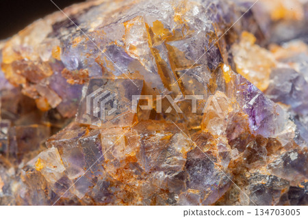 Mineral formation with fluorite crystals found in rock in middle of natural environment Mineral formation with fluorite crystals found in rock in middle of natural environment 134703005
