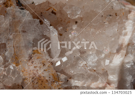 Surface of clear minerals with crystals and reflections inside 134703025