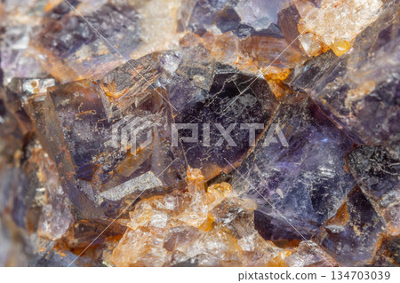Mineral formation with fluorite crystals found in rock in middle of natural environment 134703039