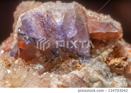 Mineral formation with fluorite crystals found in rock in middle of natural environment 134703042
