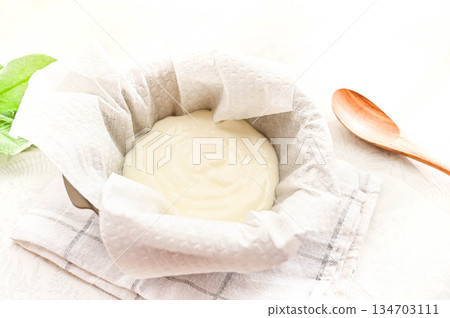 Draining cream cheese dough Draining cream cheese dough 134703111