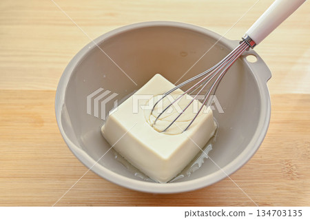 Break up the tofu with a whisk Break up the tofu with a whisk 134703135