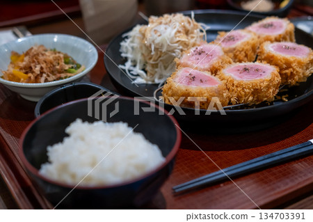 Sous vide pork katsu. Tonkatsu, Fried Pork with rice and vegetable set serve on plate in restaurant 134703391