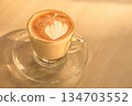 Coffee cup latte art on wooden table background with copy space. 134703552