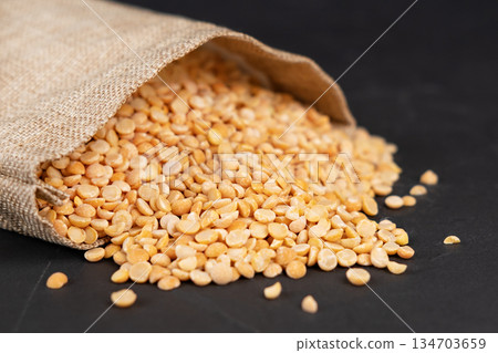 peas in a bag on a black background peas in a bag on a black background 134703659