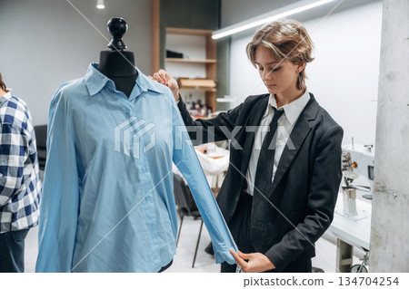 Fashion concept. People are working by the sewing machines indoors 134704254