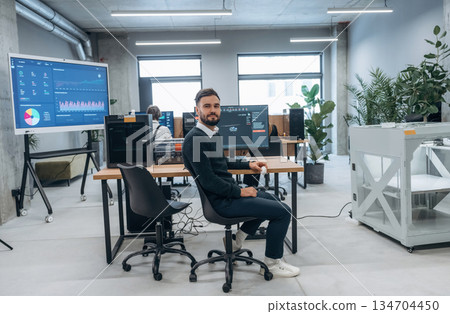 Using 3d printing software. Designer team are together in the office Using 3d printing software. Designer team are together in the office 134704450
