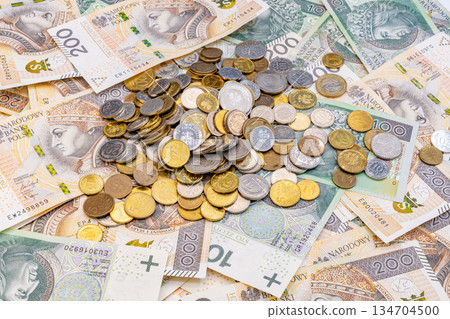 Grosz Coins on Polish 100 and 200 Zloty Money Filling the Frame Grosz Coins on Polish 100 and 200 Zloty Money Filling the Frame 134704500