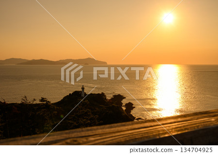 Lighthouse and sea sunset Lighthouse and sea sunset 134704925
