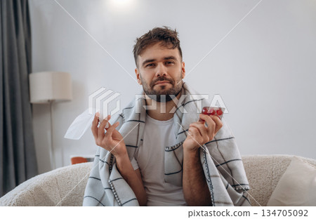 Cold, illness. Sick man is feeling bad at home Cold, illness. Sick man is feeling bad at home 134705092