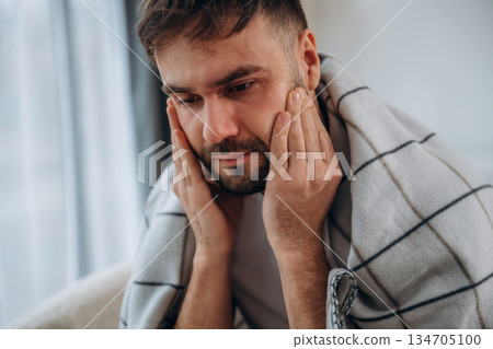 Sick man is feeling bad at home 134705100