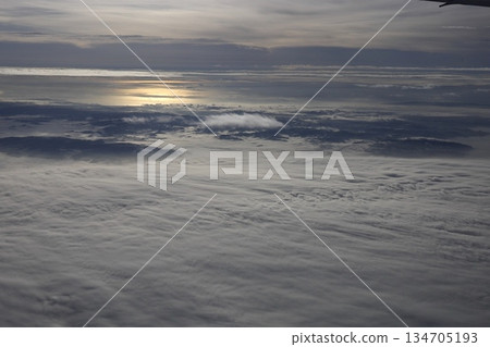 Cloudy sky from inside the plane Sea of clouds Cloudy sky from inside the plane Sea of clouds 134705193