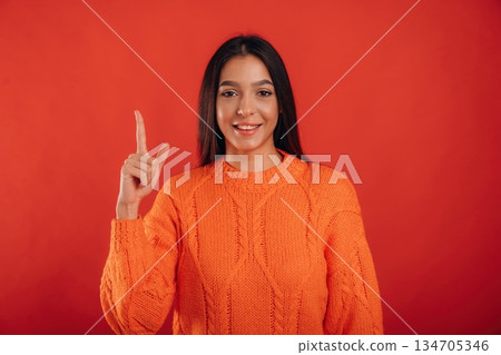 Showing up, copy space. Young beautiful woman is against background 134705346