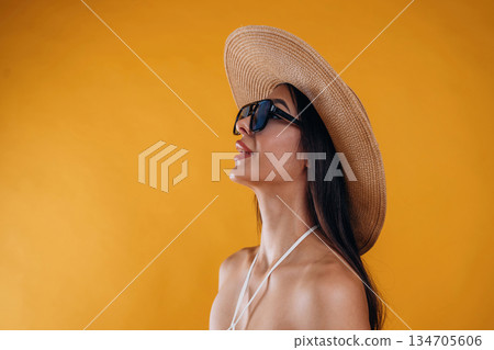 Young beautiful tourist woman is against background Young beautiful tourist woman is against background 134705606