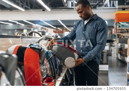 Man in a home appliance store 134705935