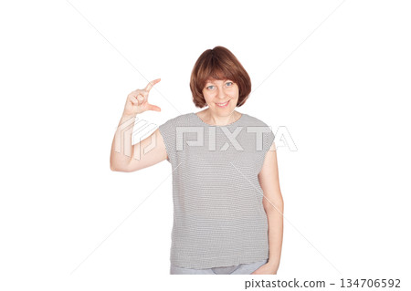 Smiling girl showing invisible product Smiling girl showing invisible product 134706592