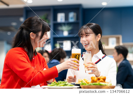 Young women having a girls' night out at an izakaya 134706612
