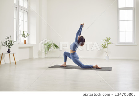 Woman Doing Active Yoga Practice Woman Doing Active Yoga Practice 134706803
