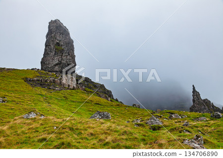 Old Man of Storr rock formation in foggy Isle of Skye Scotland Old Man of Storr rock formation in foggy Isle of Skye Scotland 134706890