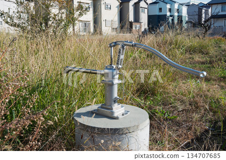 A disaster water supply pump called a "Dragon Pump" and overgrown weeds at a disaster prevention well in Matsubara City A disaster water supply pump called a "Dragon Pump" and overgrown weeds at a disaster prevention well in Matsubara City 134707685