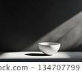 Minimalist White Bowl on a Grey Background with Sunlight 134707799