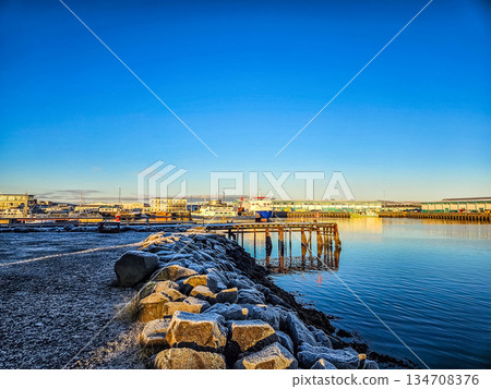 Industrial Harbor with Calm Water and Pier in Winter Industrial Harbor with Calm Water and Pier in Winter 134708376