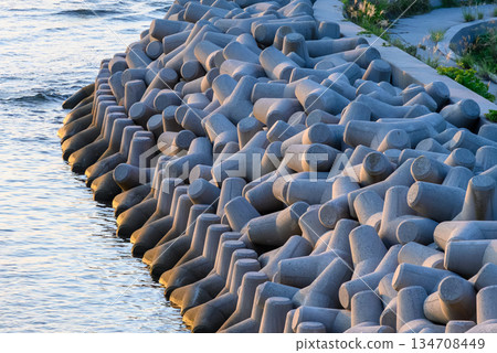 Wave-breaking blocks and water on the beach 134708449