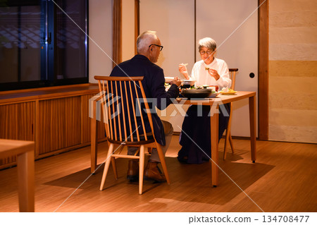 A couple having dinner at an inn A couple having dinner at an inn 134708477