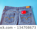 Red heart in blue jeans pocket, concept of romance. 134708673