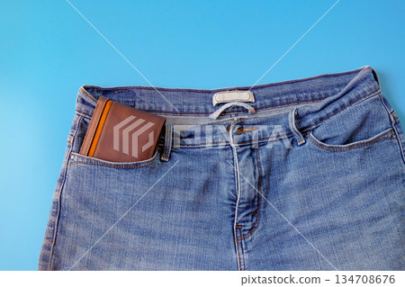 A brown pocket money in blue jeans pocket. Finances. A brown pocket money in blue jeans pocket. Finances. 134708676