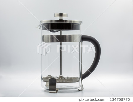 French press tea coffee maker with stainless steel frame closeup. 134708770