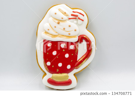 Decorated Christmas cookie shaped like hot chocolate mug closeup. Decorated Christmas cookie shaped like hot chocolate mug closeup. 134708771