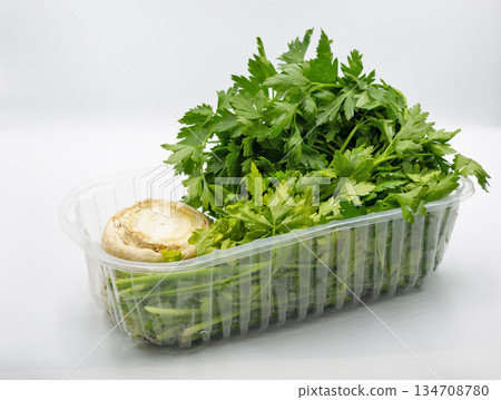 Fresh parsley with celery root closeup on white. Fresh parsley with celery root closeup on white. 134708780