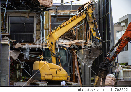 Building demolition work using heavy machinery Building demolition work using heavy machinery 134708802