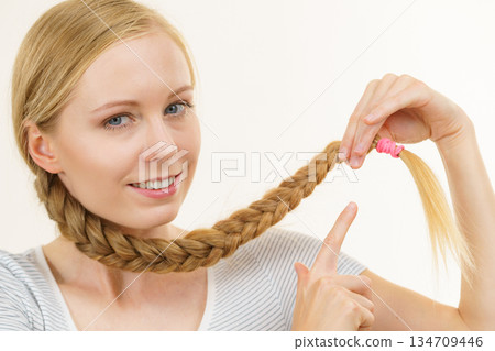 Blonde young woman with braid hair 134709446