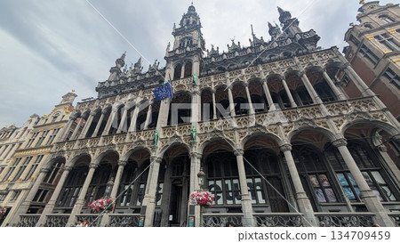 Historic architecture exterior with a flag at Grand-Place in Brussels 134709459