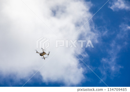 Drones soaring in the blue sky above Kouri Island, Okinawa 134709485