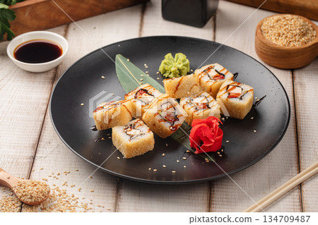 Tempura sushi rolls with sauce and sesame Tempura sushi rolls with sauce and sesame 134709487
