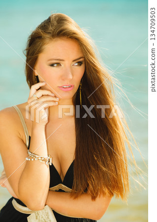 Beautiful girl on beach, summertime Beautiful girl on beach, summertime 134709503