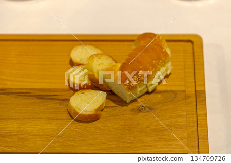 Sliced Baguette Bread Board Sliced Baguette Bread Board 134709726
