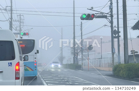 Dense fog road traffic 134710249