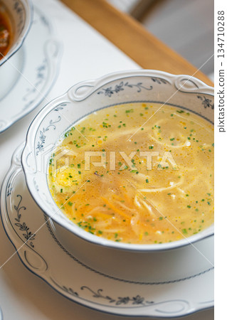 Classic chicken noodle soup with herbs 134710288