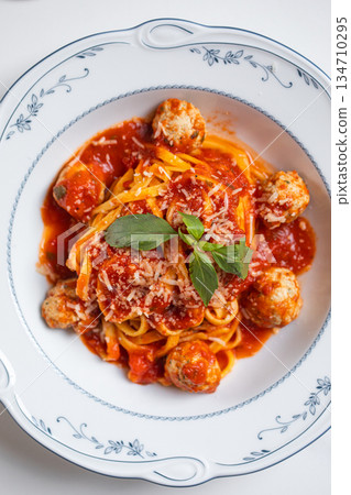 Spaghetti with meatballs in tomato sauce 134710295