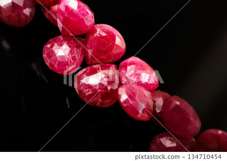 Natural Ruby Marron Cut Beads, Natural Stone, Black Background, Handmade Material Natural Ruby Marron Cut Beads, Natural Stone, Black Background, Handmade Material 134710454